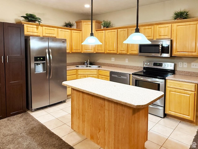 127 E Chandlerpoint Way S, Draper, UT 84020 - kitchen with a center island, light countertops, appliances with stainless steel finishes, light tile patterned flooring, and a sink