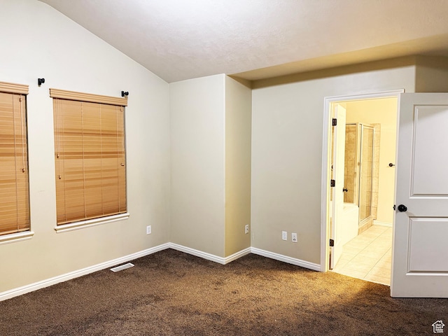 127 E Chandlerpoint Way S, Draper, UT 84020 - carpeted spare room featuring tile patterned floors, visible vents, baseboards, and vaulted ceiling