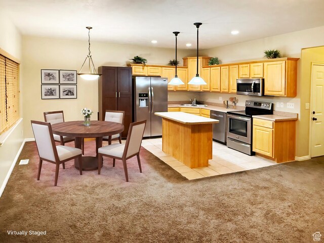 127 E Chandlerpoint Way S, Draper, UT 84020 - kitchen featuring a kitchen island, light countertops, appliances with stainless steel finishes, pendant lighting, and light colored carpet