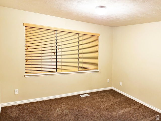 127 E Chandlerpoint Way S, Draper, UT 84020 - unfurnished room featuring visible vents, baseboards, dark colored carpet, and a textured ceiling