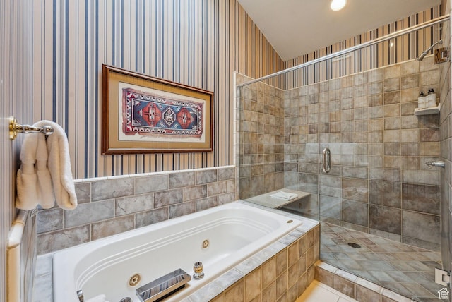 bathroom featuring separate shower and tub