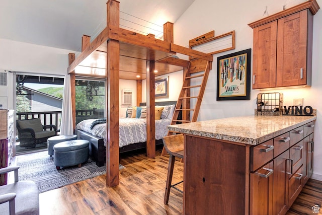 2255 Sidewinder Dr Unit 627, Park City, UT 84060 - bedroom with a wall mounted AC, access to outside, and hardwood / wood-style floors