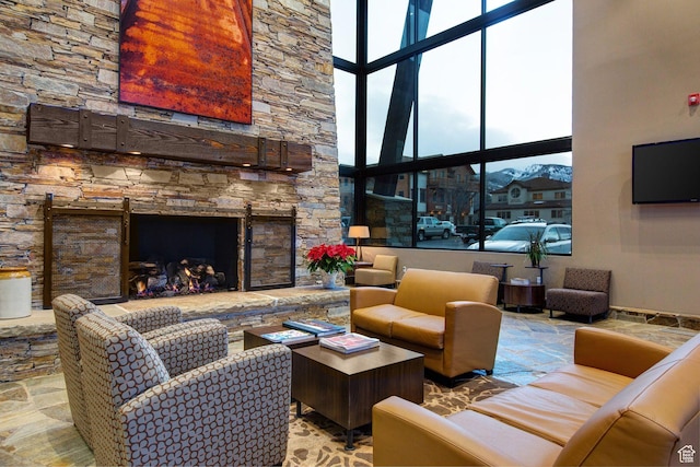 2255 Sidewinder Dr Unit 627, Park City, UT 84060 - living room with a stone fireplace and a towering ceiling
