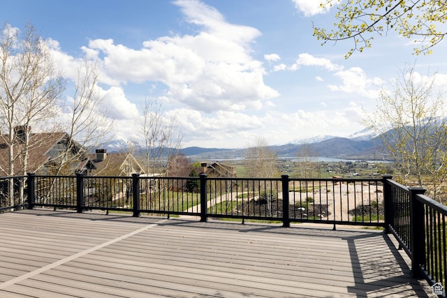wooden deck with a mountain view