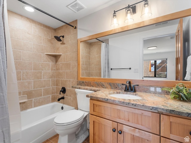 bathroom featuring visible vents, shower / tub combo with curtain, toilet, and vanity