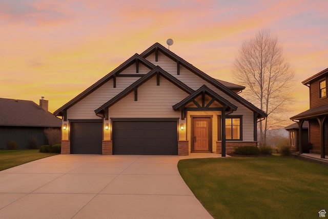 craftsman inspired home with driveway, a lawn, and a garage