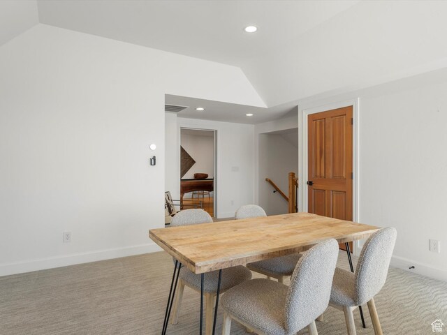 dining area with baseboards, recessed lighting, light colored carpet, and lofted ceiling