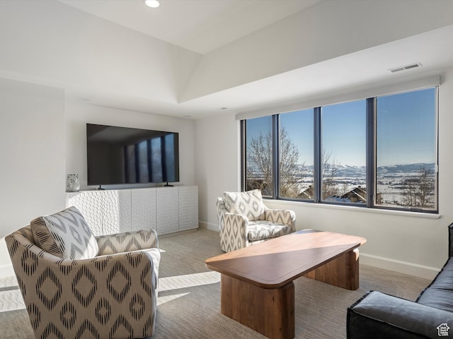 carpeted living room featuring recessed lighting, visible vents, and baseboards
