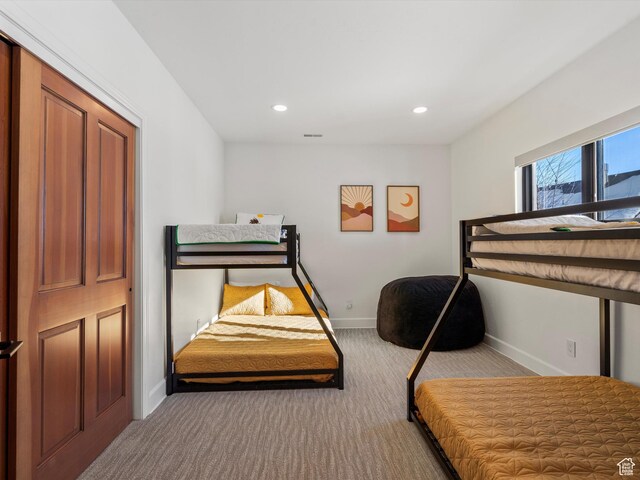 bedroom with recessed lighting, visible vents, carpet floors, and baseboards