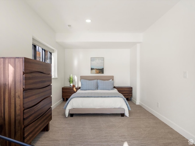 carpeted bedroom featuring recessed lighting, visible vents, and baseboards