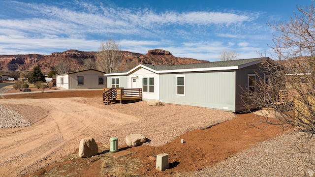 442 W Pipe Springs Dr, Kanab, UT 84741 - rear view of property with a mountain view