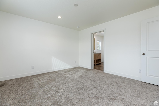 442 W Pipe Springs Dr, Kanab, UT 84741 - unfurnished bedroom with ensuite bath and carpet floors