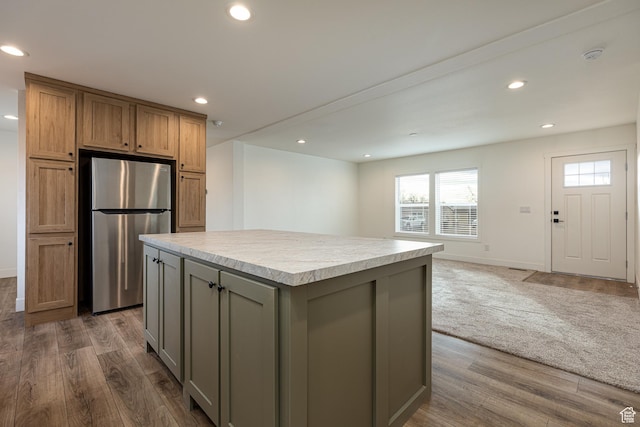442 W Pipe Springs Dr, Kanab, UT 84741 - kitchen featuring gray cabinetry, dark hardwood / wood-style floors, stainless steel refrigerator, and a kitchen island