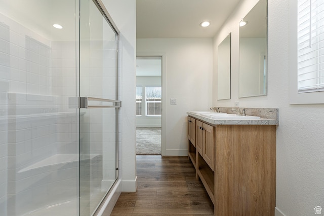 442 W Pipe Springs Dr, Kanab, UT 84741 - bathroom featuring an enclosed shower, vanity, and wood-type flooring