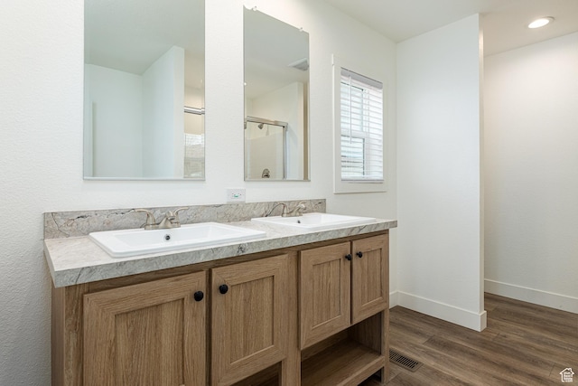 442 W Pipe Springs Dr, Kanab, UT 84741 - bathroom with wood-type flooring and vanity