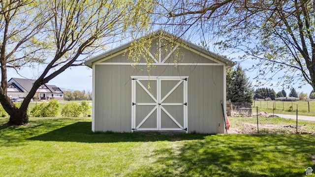 view of shed with fence