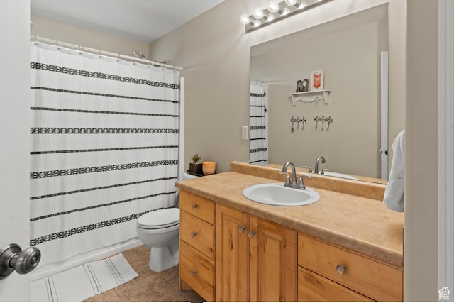 bathroom with tile patterned floors, toilet, a shower with shower curtain, and vanity