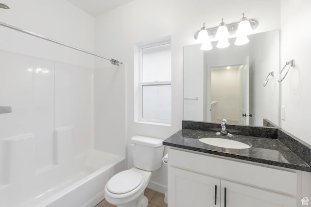 full bathroom with toilet, tub / shower combination, vanity, and baseboards