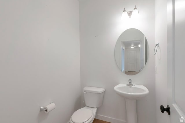 bathroom with toilet and a sink