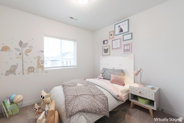 bedroom featuring carpet, visible vents, and baseboards
