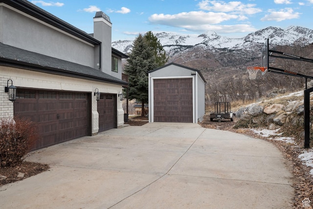 1533 Rosanna Ln, Alpine, UT 84004 - snow covered garage featuring a mountain view