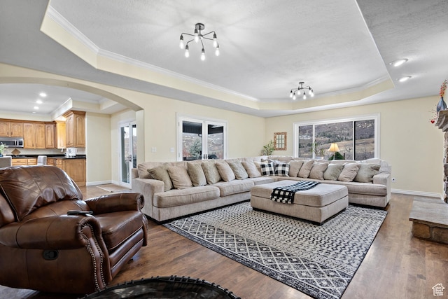 1533 Rosanna Ln, Alpine, UT 84004 - living room featuring a raised ceiling, wood-type flooring, a textured ceiling, and crown molding