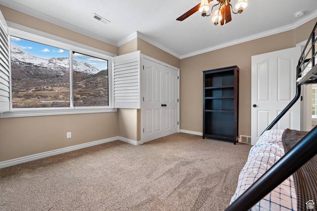 1533 Rosanna Ln, Alpine, UT 84004 - unfurnished bedroom with crown molding, ceiling fan, carpet flooring, and a closet