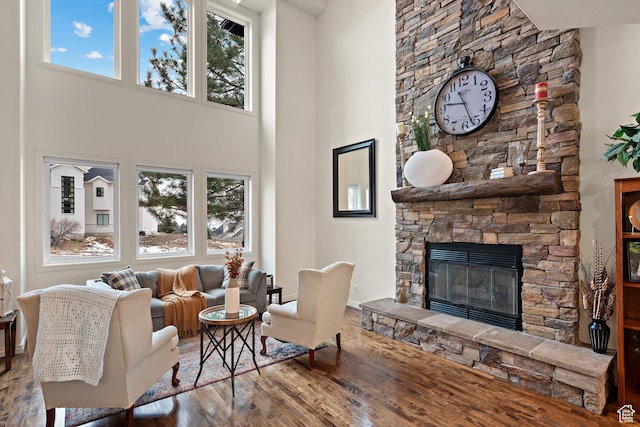 1533 Rosanna Ln, Alpine, UT 84004 - living room with hardwood / wood-style floors, a towering ceiling, and a fireplace