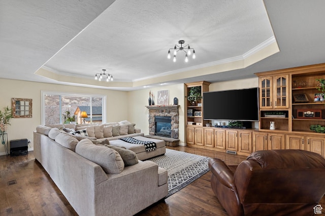 1533 Rosanna Ln, Alpine, UT 84004 - living room featuring an inviting chandelier, a tray ceiling, dark hardwood / wood-style floors, and a textured ceiling