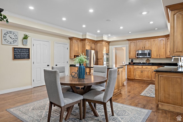 1533 Rosanna Ln, Alpine, UT 84004 - dining room featuring wood-type flooring, sink, and crown molding