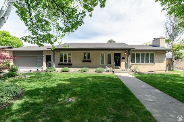 1453 E 1200 N, Logan, UT 84341 - ranch-style house with a garage, brick siding, and a chimney