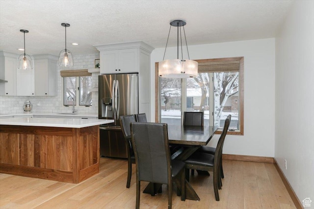 1453 E 1200 N, Logan, UT 84341 - dining space with light wood-type flooring and baseboards