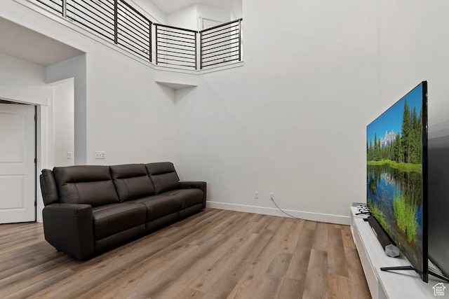 2075 N 4100 W Unit 473, Lehi, UT 84043 - living room featuring a towering ceiling and light hardwood / wood-style floors