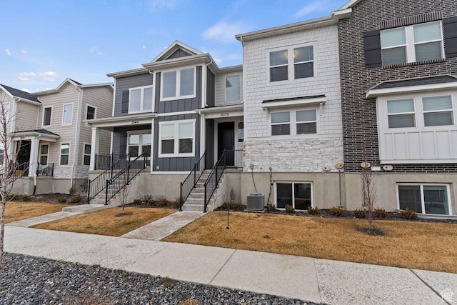 2075 N 4100 W Unit 473, Lehi, UT 84043 - view of property featuring central AC unit and a front lawn
