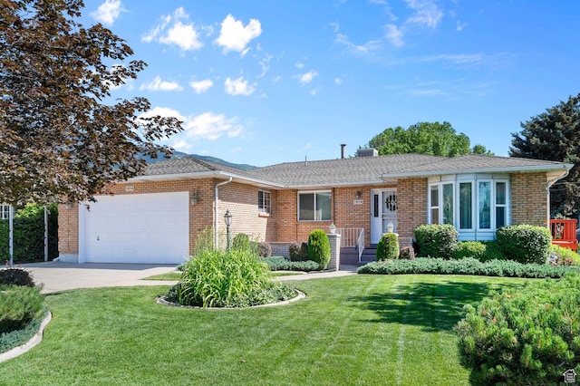 1814 E 9800th St S, Sandy, UT 84092 - ranch-style home featuring an attached garage, driveway, brick siding, and a front yard