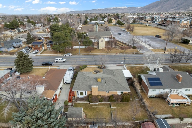 birds eye view of property featuring a mountain view and a residential view