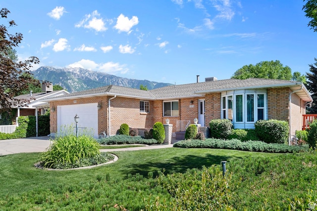 1814 E 9800th St S, Sandy, UT 84092 - ranch-style home featuring a mountain view, brick siding, concrete driveway, an attached garage, and a front yard