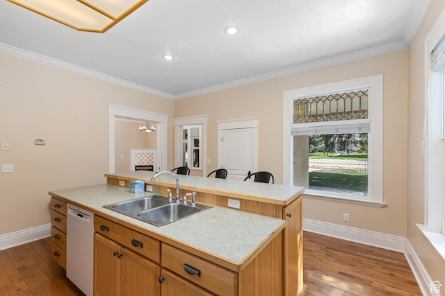 291 N Main St, Hyde Park, UT 84318 - kitchen featuring sink, light hardwood / wood-style flooring, ornamental molding, dishwasher, and a kitchen island with sink