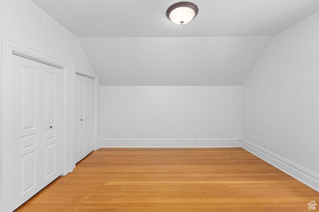 291 N Main St, Hyde Park, UT 84318 - additional living space featuring wood-type flooring and vaulted ceiling