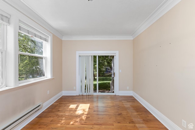 291 N Main St, Hyde Park, UT 84318 - unfurnished room featuring crown molding, a baseboard radiator, and wood-type flooring