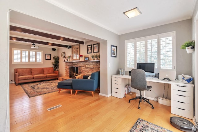 1737 N Sego Ln, Provo, UT 84604 - home office featuring beamed ceiling, a stone fireplace, plenty of natural light, and light wood-type flooring