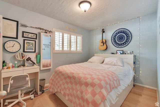1737 N Sego Ln, Provo, UT 84604 - bedroom featuring light hardwood / wood-style flooring and a textured ceiling