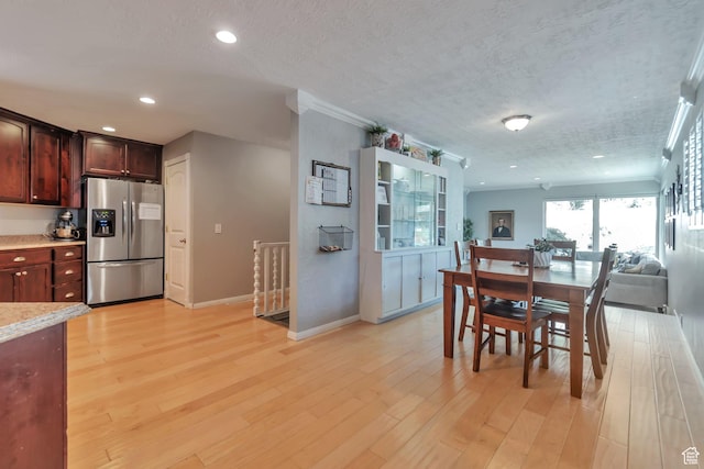 1737 N Sego Ln, Provo, UT 84604 - dining room featuring crown molding, a textured ceiling, and light wood-type flooring