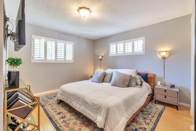 1737 N Sego Ln, Provo, UT 84604 - bedroom with a textured ceiling and light wood-type flooring
