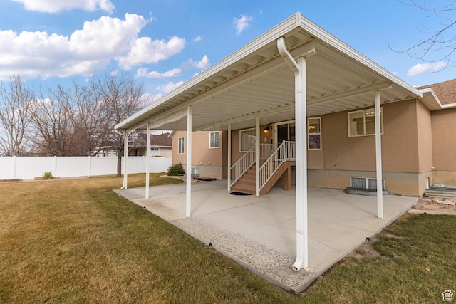 334 S Lariat Way, Grantsville, UT 84029 - rear view of property with fence, a patio, a yard, and stucco siding