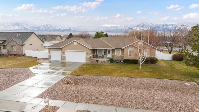 334 S Lariat Way, Grantsville, UT 84029 - single story home with a garage, driveway, fence, a front yard, and stucco siding