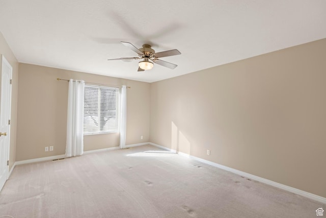 334 S Lariat Way, Grantsville, UT 84029 - spare room with baseboards, a ceiling fan, visible vents, and light carpet