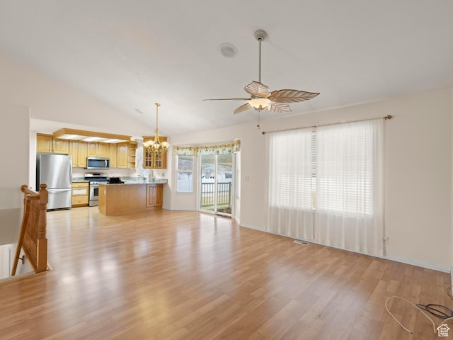 334 S Lariat Way, Grantsville, UT 84029 - unfurnished living room featuring light wood-style floors, vaulted ceiling, baseboards, and ceiling fan with notable chandelier