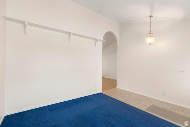 334 S Lariat Way, Grantsville, UT 84029 - unfurnished room with arched walkways and light tile patterned flooring