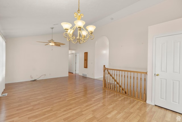 334 S Lariat Way, Grantsville, UT 84029 - unfurnished room with lofted ceiling, visible vents, arched walkways, light wood-style floors, and ceiling fan with notable chandelier